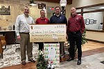 Waldo Lions Club Food Drive donation with Waldo State Bank staff in their lobby.