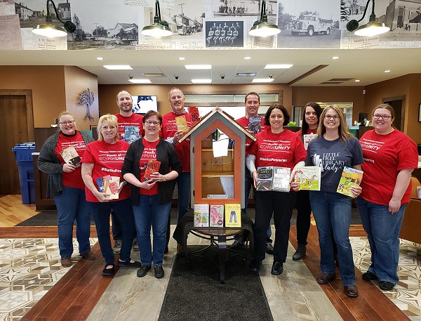 Waldo State Bank community bank employees next to their new Free Library