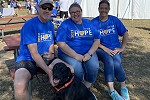 Waldo State Bank's employees and dog posing during the Mental Health Awareness Walk in September.